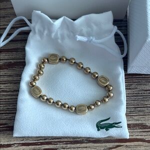 NWT: Lacoste Gold Beaded Bracelet with Logo